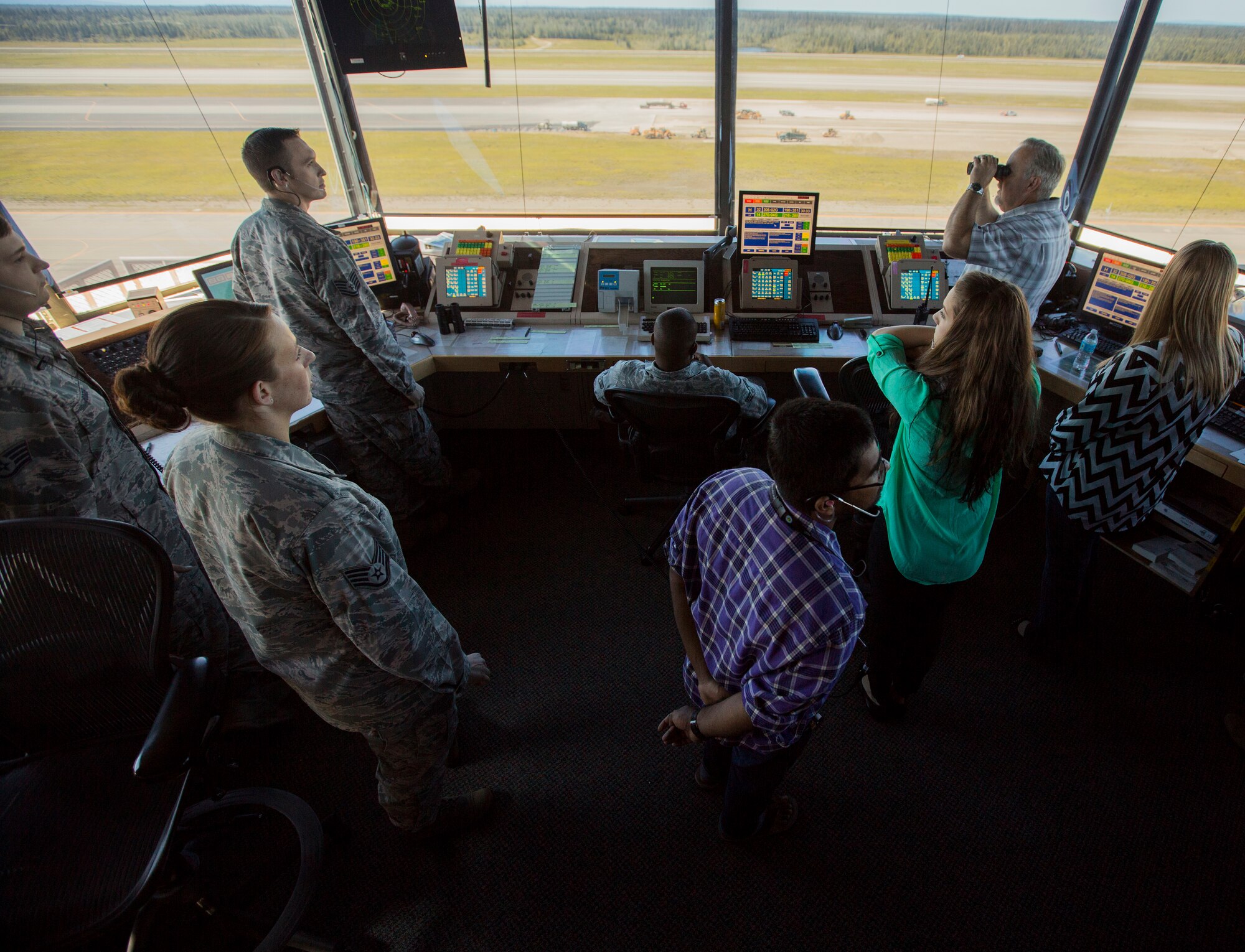 U.S. Airmen with 354th Operational Support Squadron and civilian contractors work in the control tower during Exercise Northern Edge 15 at Eielson Air Force Base, Alaska, June 17, 2015. Northern Edge is Alaska’s premier joint training exercise designed to practice operations, techniques and procedures as well as enhance interoperability among the services. Thousands of Service members from active duty, Reserve and National Guard units are involved. (U.S. Marine Corps photo by Cpl. Suzanne Dickson/ Released)
