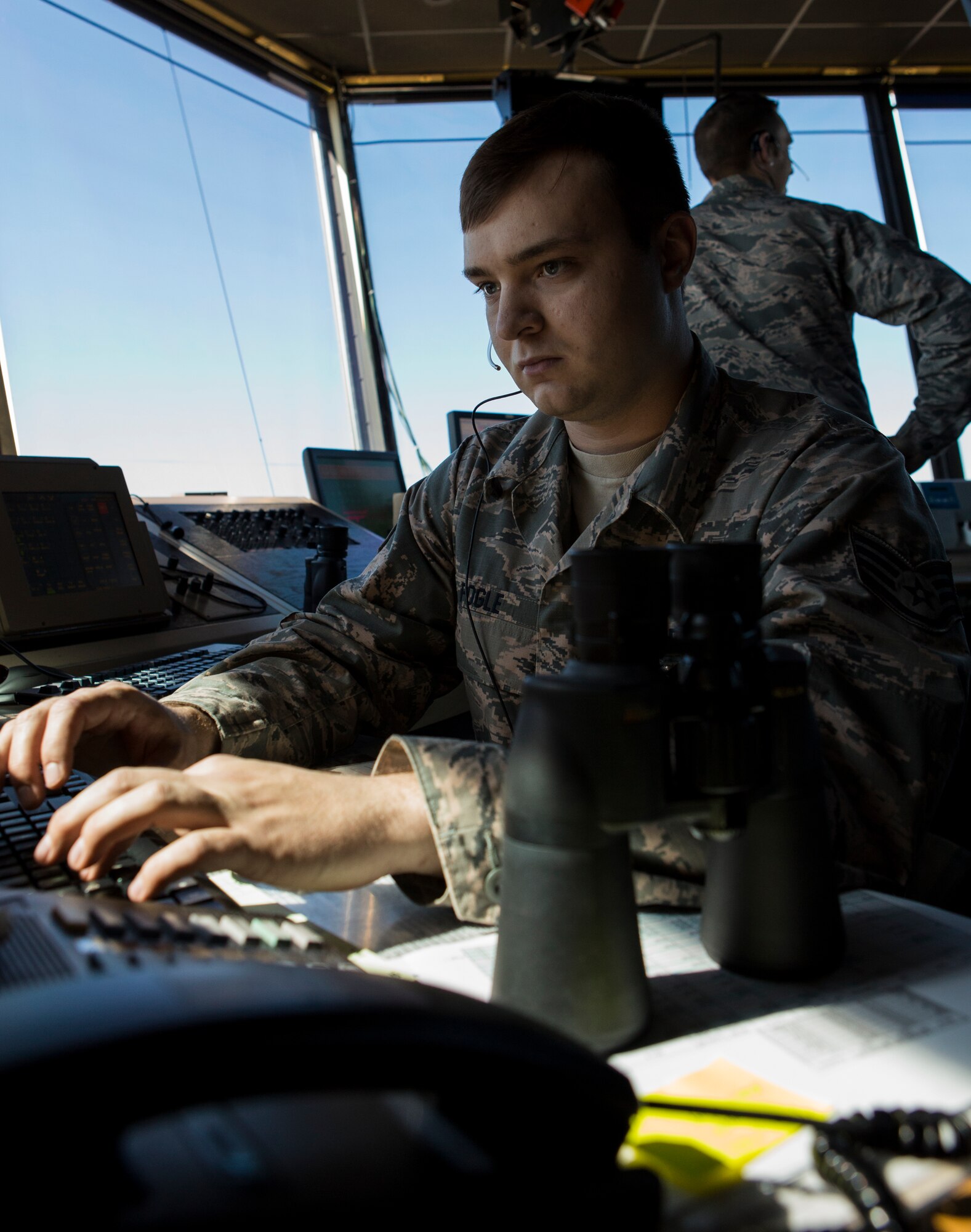 U.S. Air Force Staff Sgt. Anthony Fogle, 354th Operational Support Squadron, air traffic control, works on a computer inside the control tower during Exercise Northern Edge 15 at Eielson Air Force Base, Alaska, June 17, 2015. Northern Edge is Alaska’s premier joint training exercise designed to practice operations, techniques and procedures as well as enhance interoperability among the services. Thousands of participants from all services, Airmen, Soldiers, Sailors, Marines and Coast Guardsmen from active duty, Reserve and National Guard units are involved. (U.S. Marine Corps photo by Cpl. Suzanne Dickson/Not Released)