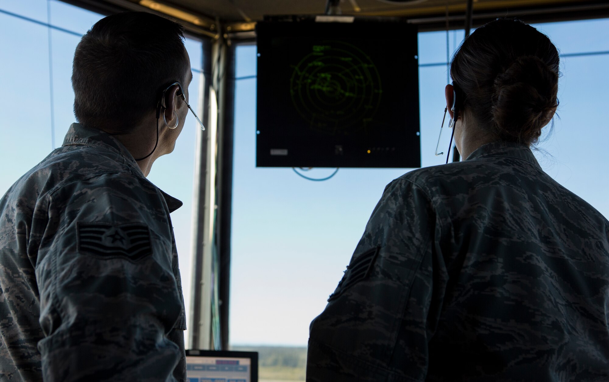 U.S. Air Force Tech. Sgt. Schler Peck, left, and Staff Sgt. Kathleen A. Peck, 354th Operational Support Squadron, air traffic control watch supervisors, observe a radar in the control tower during Exercise Northern Edge 15 at Eielson Air Force Base, Alaska, June 17, 2015. Northern Edge is Alaska’s premier joint training exercise designed to practice operations, techniques and procedures as well as enhance interoperability among the services. Thousands of Service members from active duty, Reserve and National Guard units are involved. (U.S. Marine Corps photo by Cpl. Suzanne Dickson/ Released)