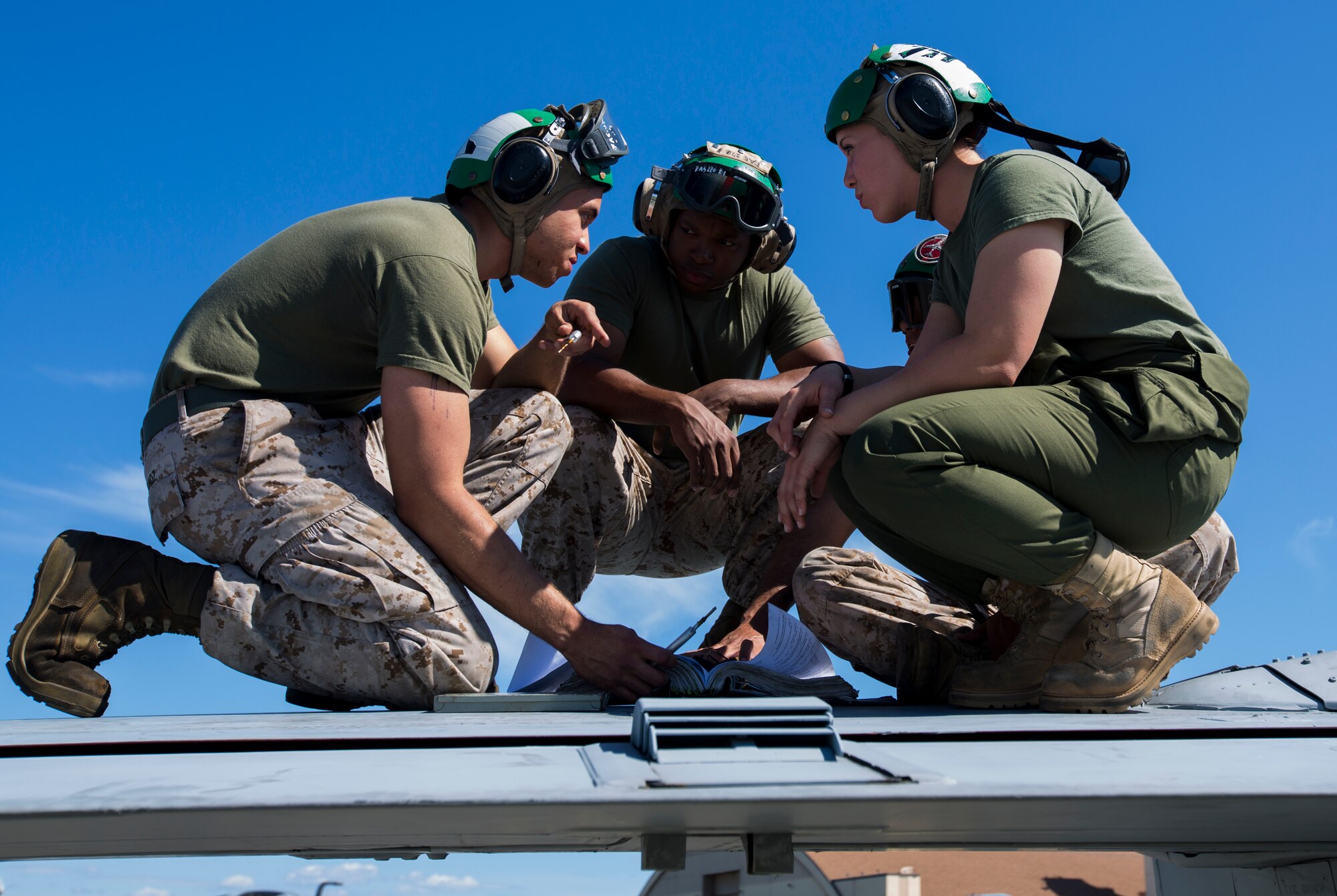 U.S. Marines with Marine Tactical Electronic Warfare Squadron (VMAQ) 2, 2nd Marine Aircraft Wing, conduct maintenance on the wing of a U.S. Marine Corps EA-6B Prowler assigned to VMAQ-2, during Exercise Northern Edge 15 at Eielson Air Force Base, Alaska, June 17, 2015. Northern Edge is Alaska’s premier joint training exercise designed to practice operations, techniques and procedures as well as enhance interoperability among the services. Thousands of Service members from active duty, Reserve and National Guard units are involved. (U.S. Marine Corps photo by Cpl. Suzanne Dickson/ Released)
