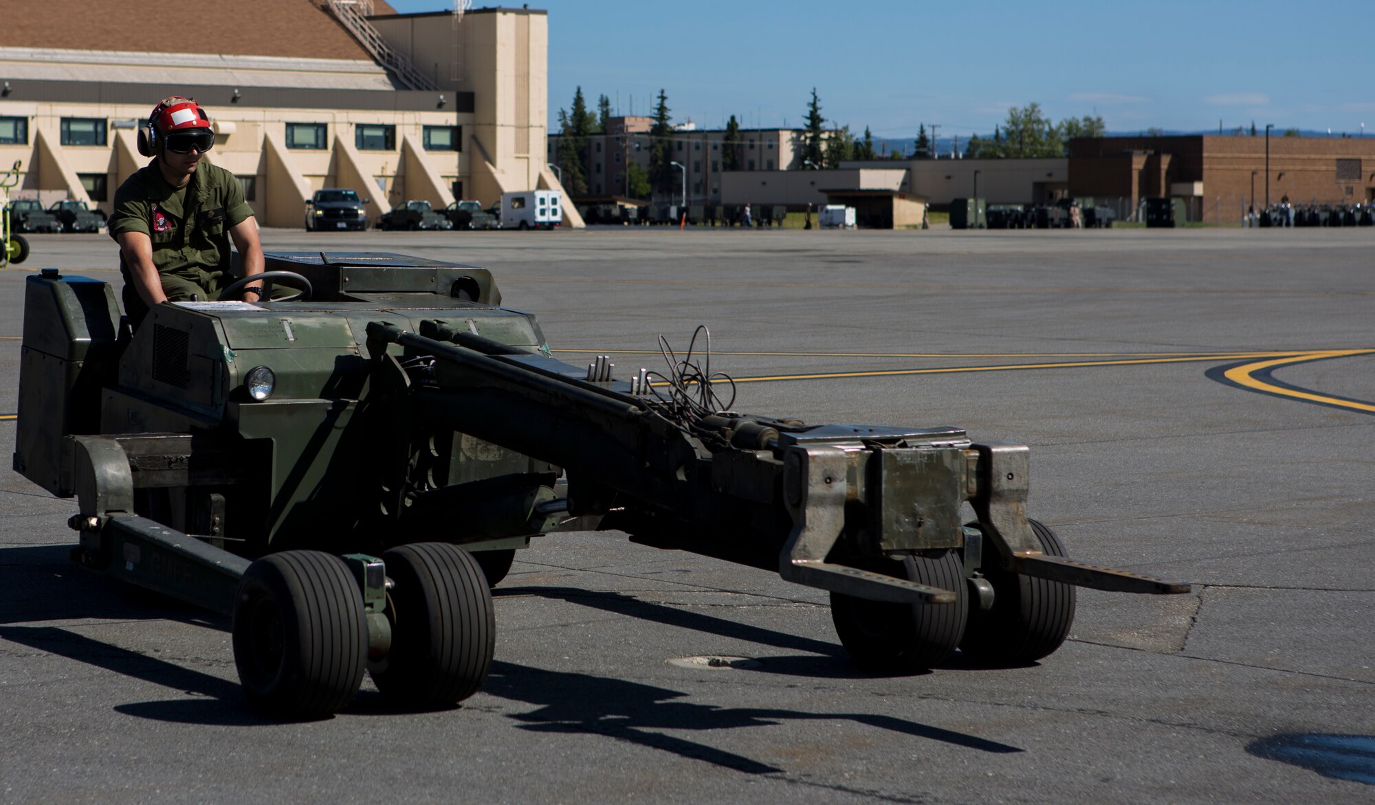 U.S. Marine Corps Lance Cpl. Diego G. Ramirezsantos, ordnance technician, Marine Tactical Electronic Warfare Squadron 2, 2nd Marine Aircraft Wing, operates a short space airfield tactical support loader on the flight line during Exercise Northern Edge 15 at Eielson Air Force Base, Alaska, June 17, 2015. Northern Edge is Alaska’s premier joint training exercise designed to practice operations, techniques and procedures as well as enhance interoperability among the services. Thousands of Service members from active duty, Reserve and National Guard units are involved. (U.S. Marine Corps photo by Cpl. Suzanne Dickson/ Released)