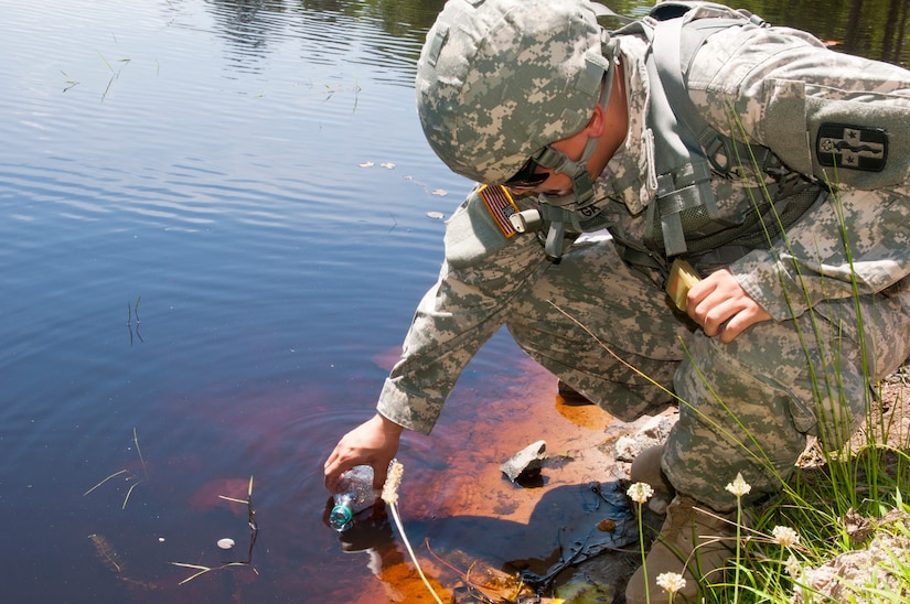 Army Reserve Spc. John Patrick Ga, a light wheel vehicle mechanic with the 988th Medical Detachment from Round Rock, Texas, collects water samples for testing as part of the Quartermaster Liquid Logistic Exercise (QLLEX) portion of the Combat Sustainment Training Exercise (CSTX) Global Lightning 2015 at Joint Base McGuire-Dix-Lakehurst, June 11, 2015. (Photo by Spc. Samuel Al-Nimri)