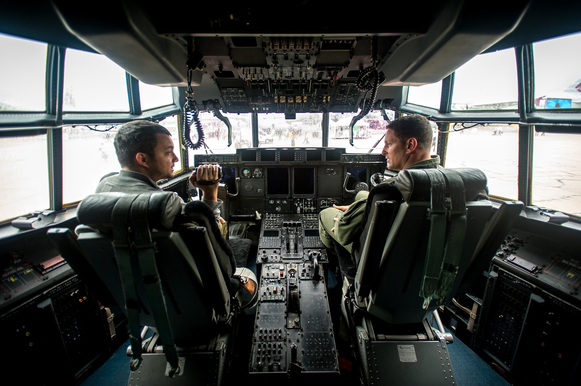 PARIS - Capt. Scott Stapp, WC-130J weatherbird pilot, answers questions about his mission for a reporter during the Paris Air Show at Le Bourget Airport, France, June 18, 2015. The Paris Air Show provides a collaborative opportunity to share and strengthen the U.S. and European strategic partnership that has been forged during the last seven decades and is built on a foundation of shared values, experiences and vision. The event is expected to bring in 315,000 people, a record 2,215 companies, 150 aircraft, and will span 324,000 square meters. (U.S. Air Force photo/ Tech. Sgt. Ryan Crane)