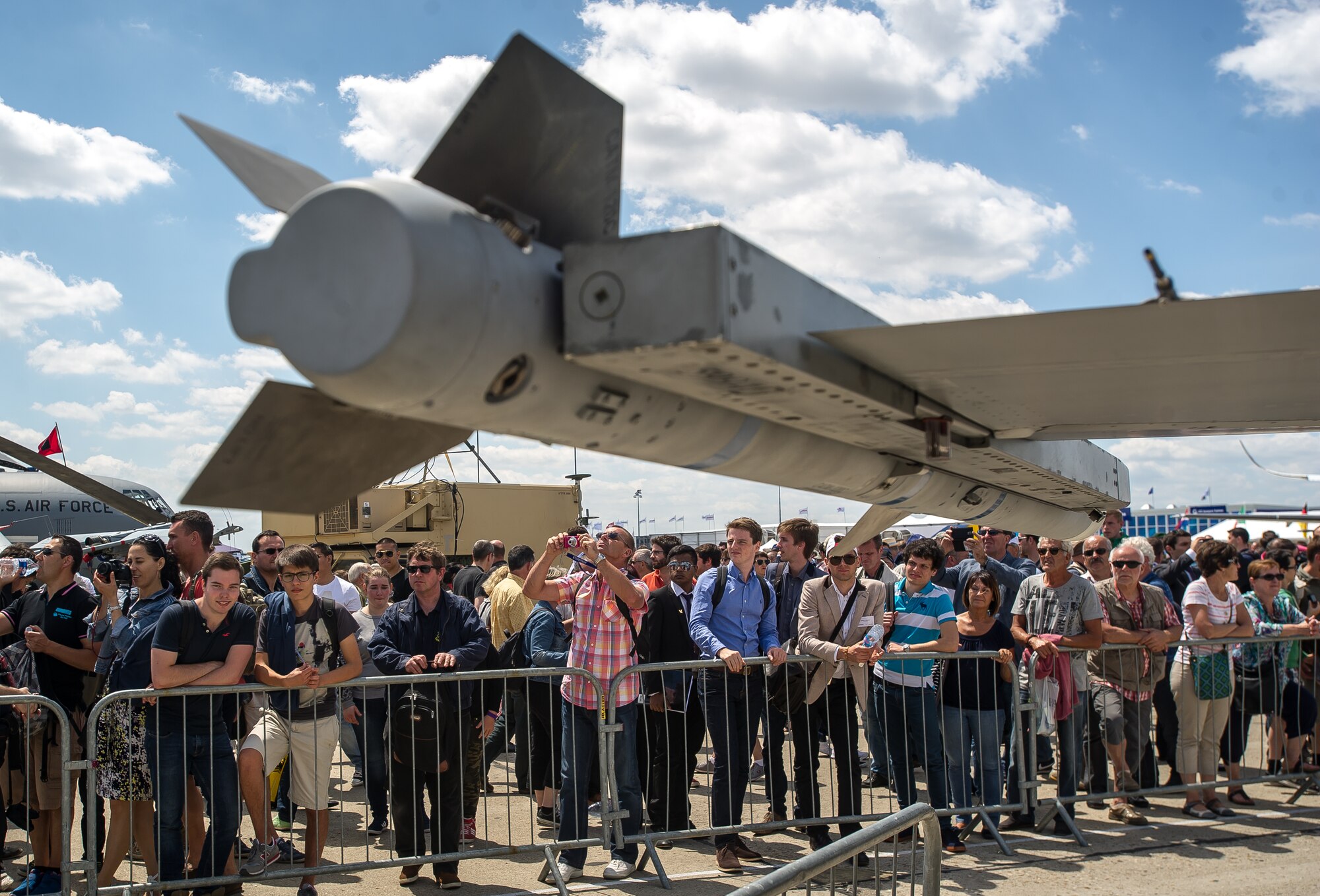 PARIS - Air show fans take pictures and tour the U.S. military aircraft during the Paris Air Show at Le Bourget Airport, France, June 19, 2015. The Paris Air Show provides a collaborative opportunity to share and strengthen the U.S. and European strategic partnership that has been forged during the last seven decades and is built on a foundation of shared values, experiences and vision. The event is expected to bring in 315,000 people, a record 2,215 companies, 150 aircraft, and will span 324,000 square meters. (U.S. Air Force photo/ Tech. Sgt. Ryan Crane)