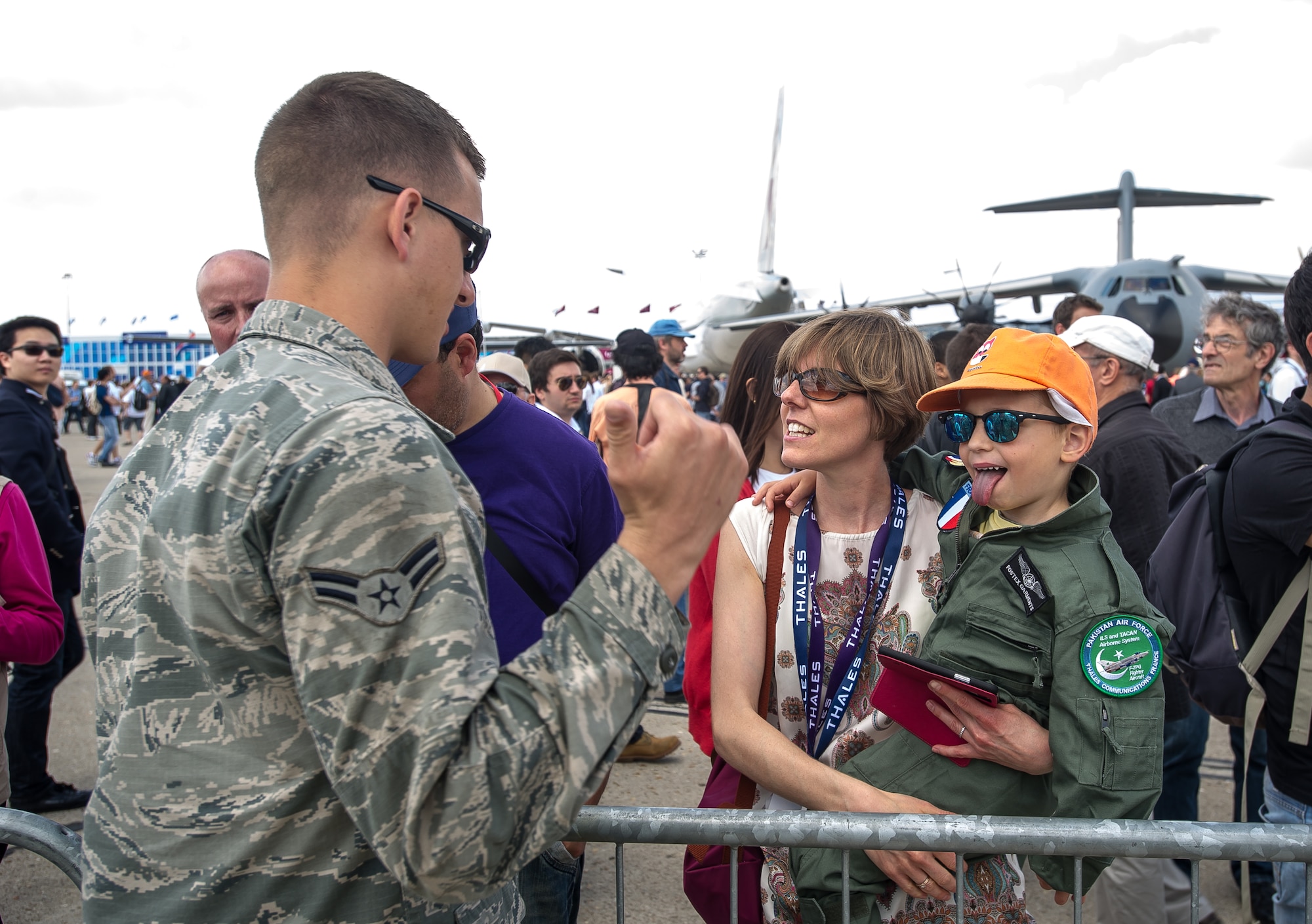 PARIS - U.S. military members meet their fans during the Paris Air Show at Le Bourget Airport, France, June 19, 2015. The Paris Air Show provides a collaborative opportunity to share and strengthen the U.S. and European strategic partnership that has been forged during the last seven decades and is built on a foundation of shared values, experiences and vision. The event is expected to bring in 315,000 people, a record 2,215 companies, 150 aircraft, and will span 324,000 square meters. (U.S. Air Force photo/ Tech. Sgt. Ryan Crane)