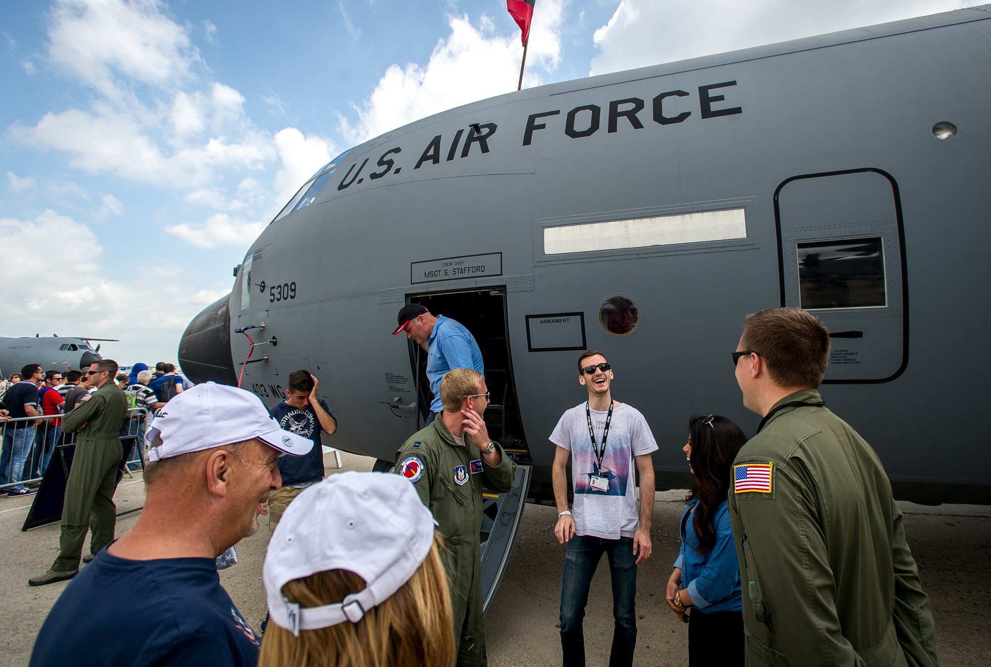 PARIS - Air show fans speak to the WC-130J weatherbird aircrew about their mission during the Paris Air Show at Le Bourget Airport, France, June 19, 2015. The Paris Air Show provides a collaborative opportunity to share and strengthen the U.S. and European strategic partnership that has been forged during the last seven decades and is built on a foundation of shared values, experiences and vision. The event is expected to bring in 315,000 people, a record 2,215 companies, 150 aircraft, and will span 324,000 square meters. (U.S. Air Force photo/ Tech. Sgt. Ryan Crane)
