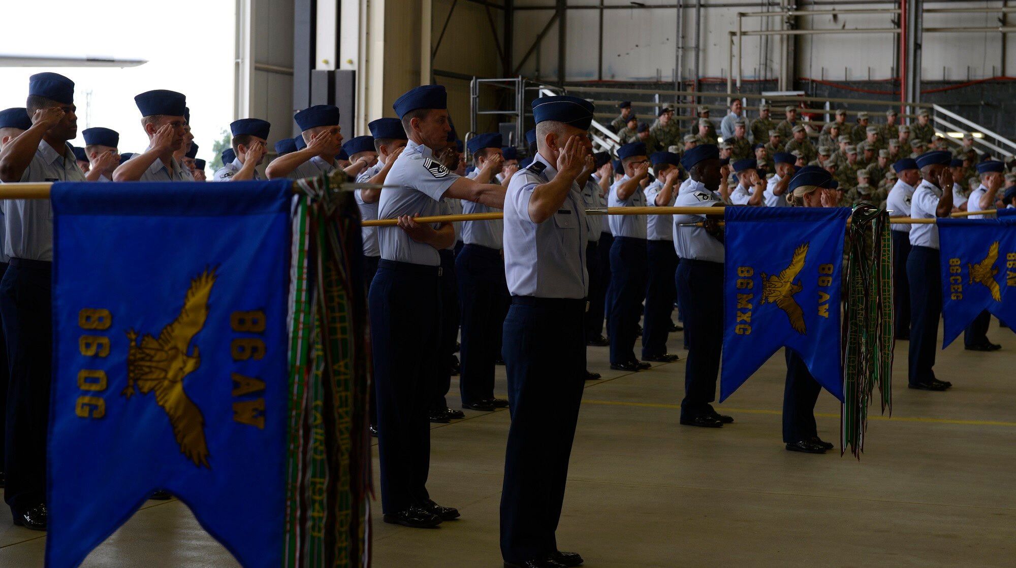 Airmen from the 86th Airlift Wing render their first salute to Brig. Gen. Jon T. Thomas, 86th AW commander, during a change of command ceremony June 19, 2015, at Ramstein Air Base, Germany. Thomas assumed command of the wing from Brig. Gen. Patrick X. Mordente and will be responsible for six groups, 27 squadrons and 10 geographically separated units across five countries including the United Kingdom, Spain, Belgium and Turkey. (U.S. Air Force photo/Airman 1st Class Tryphena Mayhugh) 