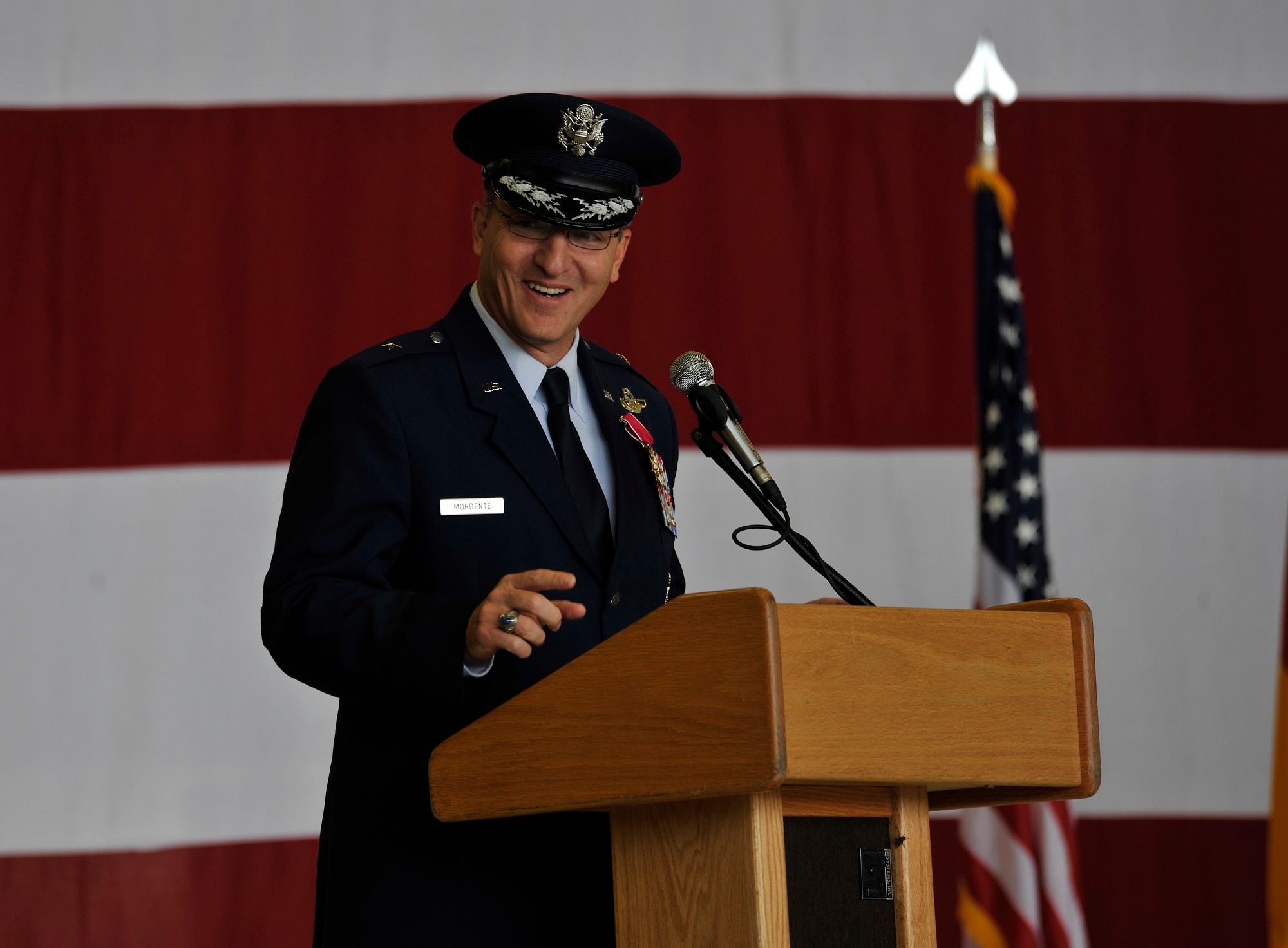 Brig. Gen. Patrick X. Mordente, outgoing 86th Airlift Wing commander, gives a speech during a change of command ceremony June 19, 2015, at Ramstein Air Base, Germany. Mordente relinquished command of the largest wing in Europe to Brig. Gen. Jon T. Thomas and will move on to serve as Vice Commander, 18th Air Force, Air Mobility Command, Scott Air Force Base, Ill. (U.S. Air Force photo/Airman 1st Class Tryphena Mayhugh) 
