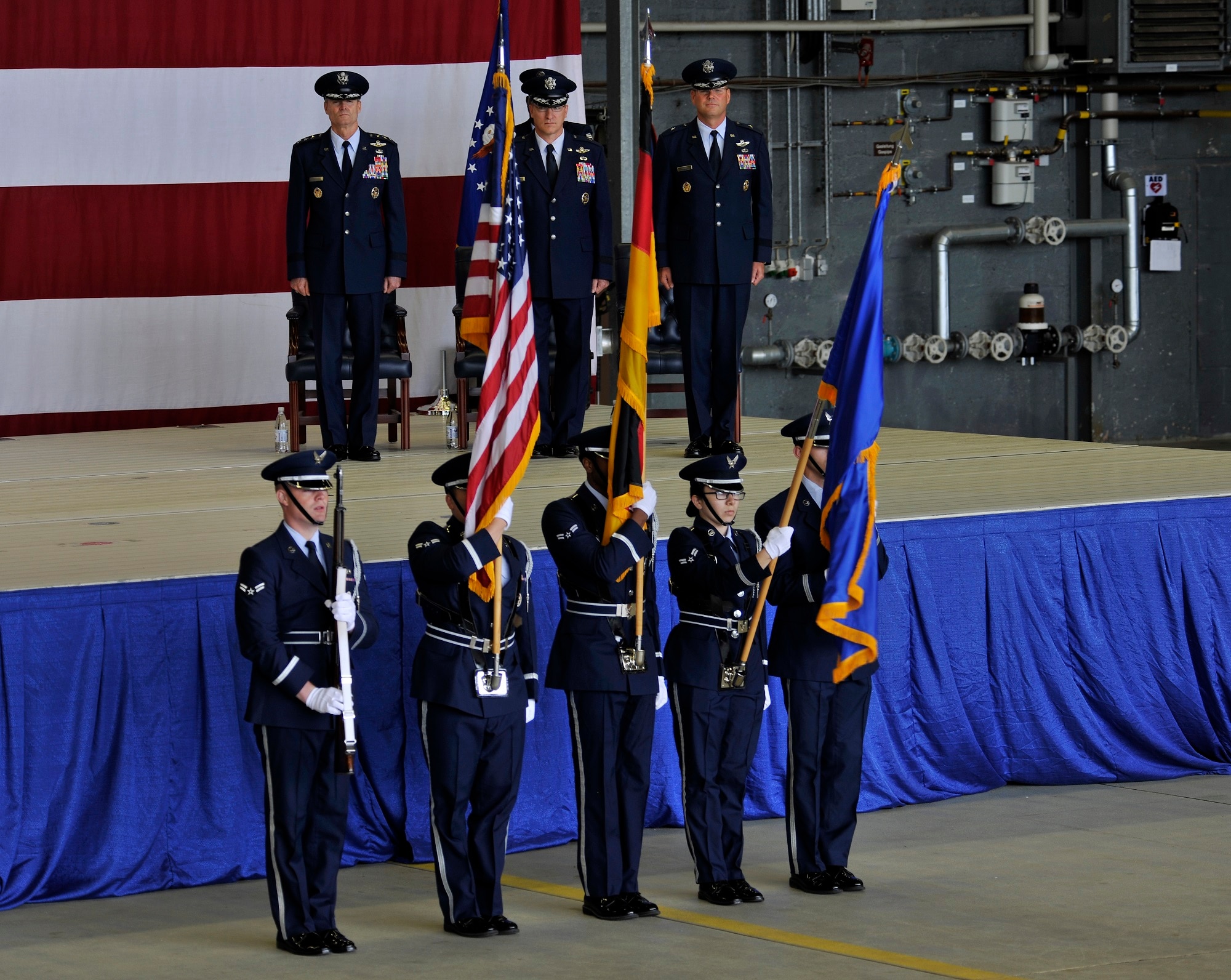 The base honor guard posts the colors during a change of command ceremony June 19, 2015, at Ramstein Air Base, Germany. Brig. Gen. Jon T. Thomas assumed command of the 86th Airlift Wing from Brig. Gen. Patrick X. Mordente, and will be responsible for six groups, 27 squadrons and 10 geographically separated units across five countries including the United Kingdom, Spain, Belgium and Turkey.
(U.S. Air Force photo/Airman 1st Class Tryphena Mayhugh)
