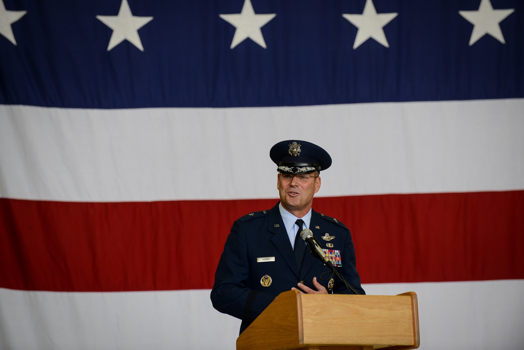 Brig. Gen. Jon T. Thomas, 86th Airlift Wing commander, gives his initial speech during the 86th AW change of command ceremony June 19, 2015, Ramstein Air Base, Germany. Before assuming command of the 86th AW, he served as the Deputy Director for Future Joint Force Development at the Joint Staff/J7 in  Suffolk, Va. (U.S. Air Force photo/Senior Airman Nicole Sikorski)