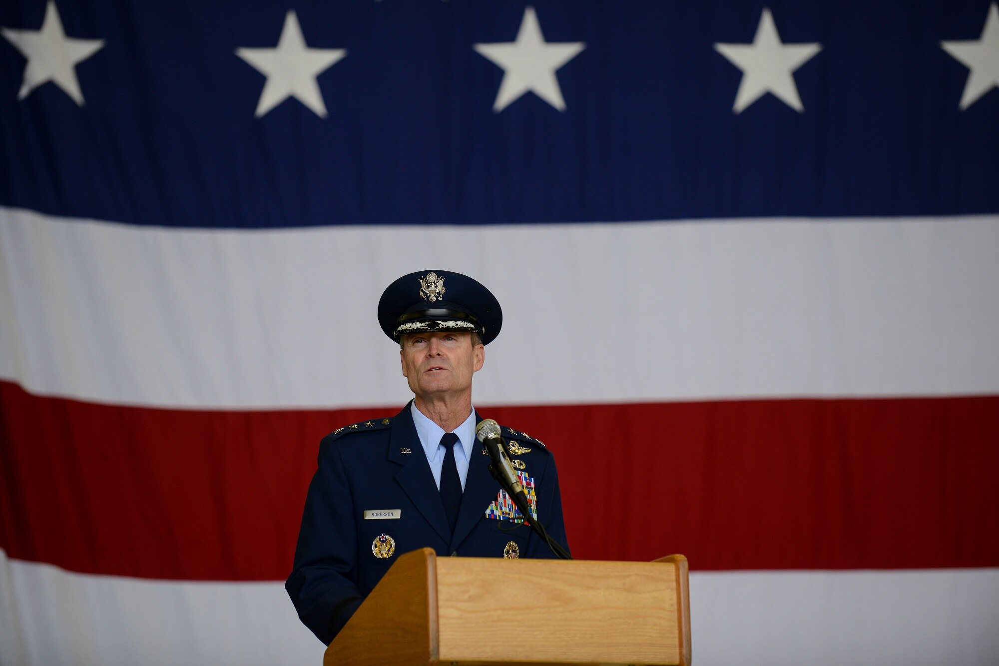 Lt. Gen. Darryl L. Roberson, 3rd Air Force and 17th Expeditionary Air Force commander, speaks during the 86th Airlift Wing change of command ceremony June 19, 2015, Ramstein Air Base, Germany.  At the ceremony, Brig. Gen. Patrick X. Mordente relinquished command to Brig. Gen. Jon T. Thomas. Thomas, who arrived from Suffolk, Va. as the Joint Staff/J7 Deputy Director for Future Joint Force Development, is a command pilot with over three thousand flight hours and has commanded at the squadron, group and wing levels. (U.S. Air Force photo/Senior Airman Nicole Sikorski)