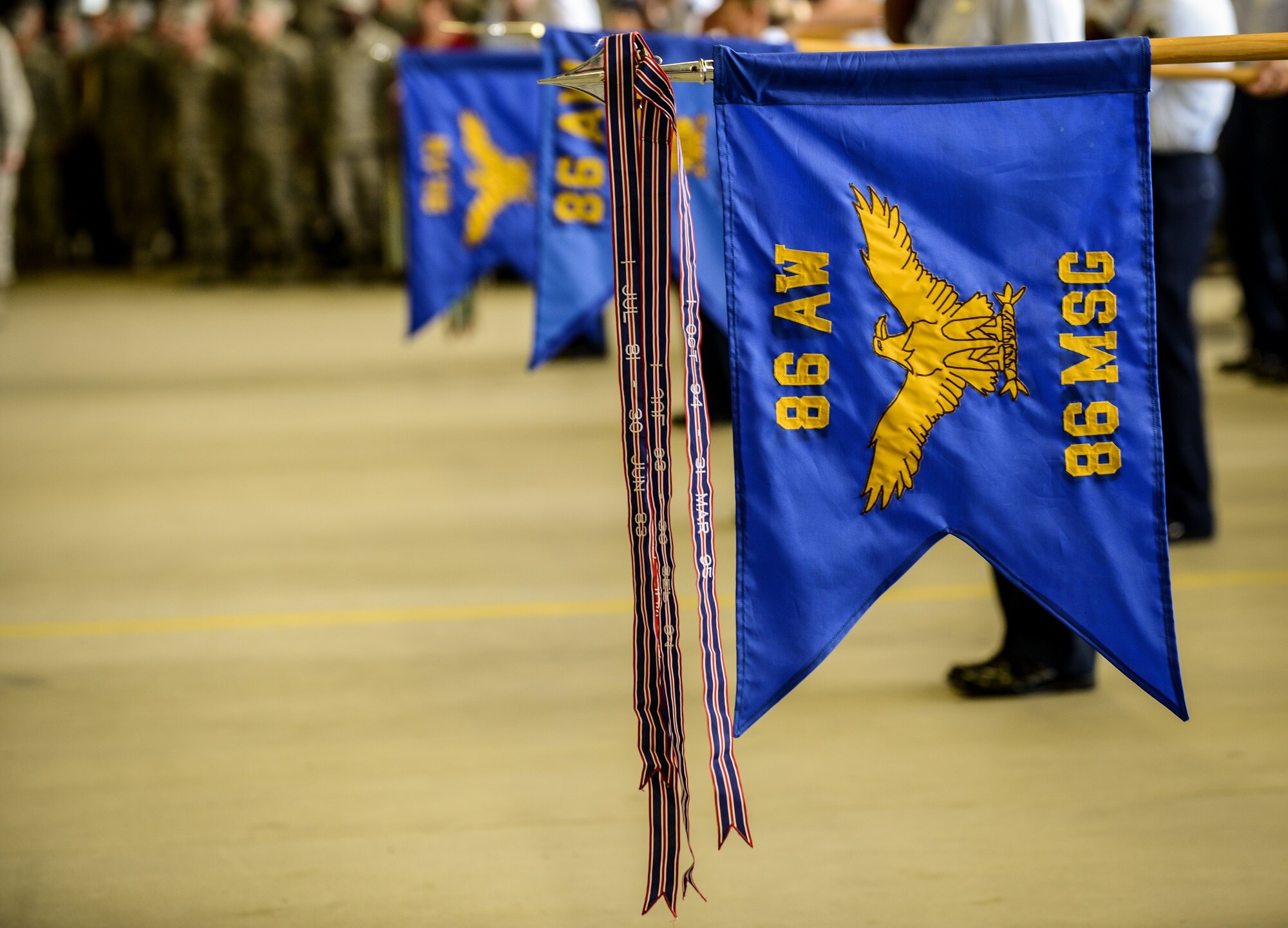 A guidon is lowered during the presentation of the colors at the 86th Airlift Wing change of command ceremony June 19, 2015, Ramstein Air Base, Germany. Brig. Gen. Jon T. Thomas assumed command from Brig. Gen. Patrick X. Mordente and will now be responsible for six groups, 27 squadrons and 10 geographically separated units across five countries including the United Kingdom, Spain, Belgium and Turkey. (U.S. Air Force photo/Senior Airman Nicole Sikorski)