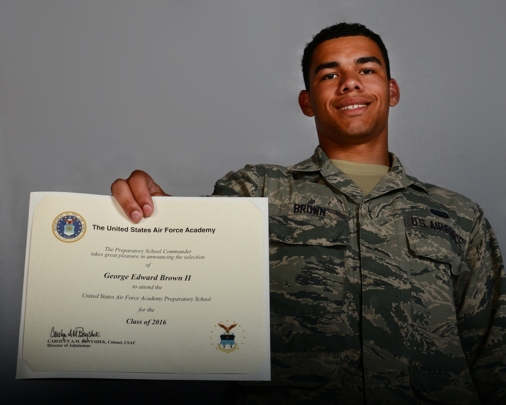 Airman 1st Class George Brown II, 39th Communications Squadron client systems technician, holds his acceptance certificate to the U.S. Air Force Academy Preparatory School June 19, 2015, at Incirlik Air Base, Turkey. Brown was notified on May 15, 2015, that he will be attending the USAF Prep School in July in preparation to attend the USAF Academy upon graduation in 2016. (U.S. Air Force photo by Airman 1st Class Cory W. Bush/Released)