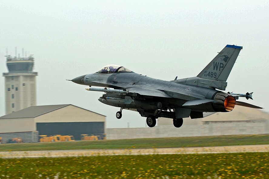 An F-16 Fighting Falcon takes off during Surge Week at Kunsan Air Base, Republic of Korea, June 17, 2015. Surge Week tested the skills and wartime capabilities of Wolf Pack operators, maintainers and supporting agencies over a four-day window to simulate pilots' wartime flying rates. (U.S. Air Force photo by Senior Airman Divine Cox/Released)