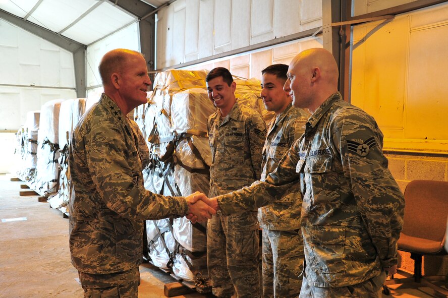 Lt. Gen. Stephen Wilson, Air Force Global Strike Command commander, greets Senior Airman Daniel Shoemaker, 5th Logistic Readiness Squadron mobility readiness spare package specialist, during his visit to Royal Air Force Fairford, England, June 18, 2015. Wilson visited RAF Fairford to observe the forward-deployed forces performing their mission in the European area of operations during the BALTOPS 15 and Saber Strike 15 multi-national exercises and to answer questions from the Airmen. (U.S. Air Force photo/Senior Airman Malia Jenkins)