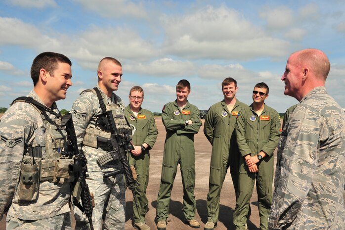 Lt. Gen. Stephen Wilson, Air Force Global Strike Command commander, talks with Airman 1st Class Scott Cowell (left) and Airman 1st Class Joseph Houseman, 5th Security Forces Squadron defenders, during his visit to Royal Air Force Fairford, England, June 18, 2015. Over 300 military personnel from five U.S. bases deployed to RAF Fairford to support of a bomber deployment that tested personnel in hot-pit refueling and engine running crew changes on B-2 Spirits and supported B-52 Stratofortress missions in the multi-national exercises BALTOPS 15 and Saber Strike 15. Wilson visited the base to see how the Airmen completed their mission in a forward-deployed location and asked if there was anything they needed from him to help them complete their mission and maintain morale. (U.S. Air Force photo/Senior Airman Malia Jenkins)