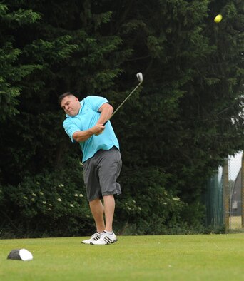 Andres Alvarez, 100th Logistics Readiness Squadron fuels environmental safety officer from Live Oak, Calif, plays a mid-iron shot into the short 160-yard par 3 fourth hole during the RAF Mildenhall intramural golf match June 17, 2015, at Breckland Pines Golf Club, RAF Lakenheath, England. The overall team score was 352nd Special Operations Aircraft Maintenance Squadron 8, the 100th LRS 4 on the nine-hole heathland type course with 18 different tee positions. (U.S. Air Force photo by Gary Rogers/Released)