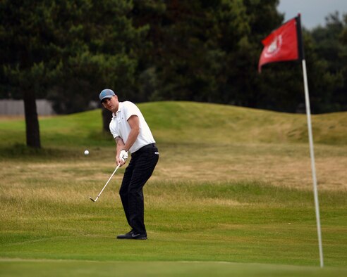 Brian Brock, 352nd Special Operations Maintenance Squadron consolidated tool kit custodian from Emerson, Ark., chips a ball during an RAF Mildenhall intermural golf match June 17, 2015, at the Breckland Pines Golf Club on RAF Lakenheath, England. The 352nd SOAMXS won with a score of 8 to 4 against 100th Logistics Readiness Squadron. (U.S. Air Force photo by Senior Airman Christine Halan/Released)