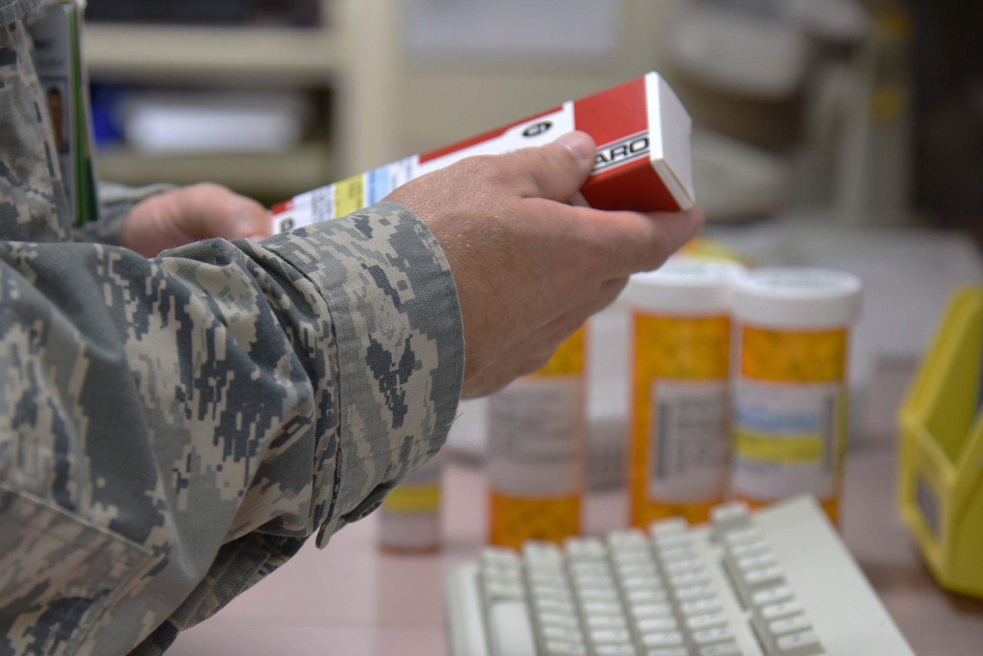 U.S. Air Force Capt. Justin Read, 35th Medical Support Squadron chief of outpatient pharmacy, prepares a patient’s prescription for processing and pick up at Misawa Air Base, Japan, June 17, 2015. When a patient’s prescription has been selected by a doctor, Read will find it, type in the patient’s information verify recipient information and then ready the medicine for pick up. (U.S. Air Force photo by Senior Airman Patrick S. Ciccarone/Released)