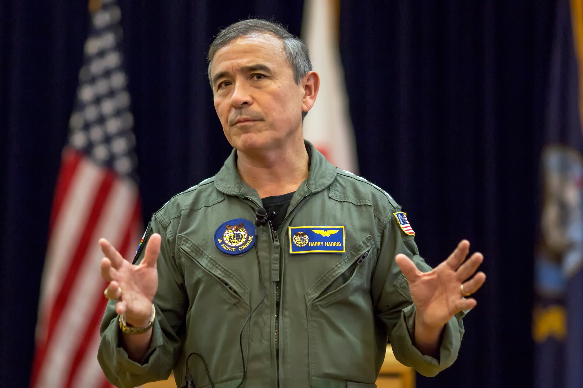 U.S. Pacific Command Commander Adm. Harry B. Harris Jr., addresses an audience of Team Yokota service members during a town hall meeting at Yokota Air Base, Japan, June 11, 2015. Harris visited Yokota during his first official visit to the Indo-Asia Pacific region, with stops in Korea and Japan. (U.S. Air Force photo by Osakabe Yasuo/Released)