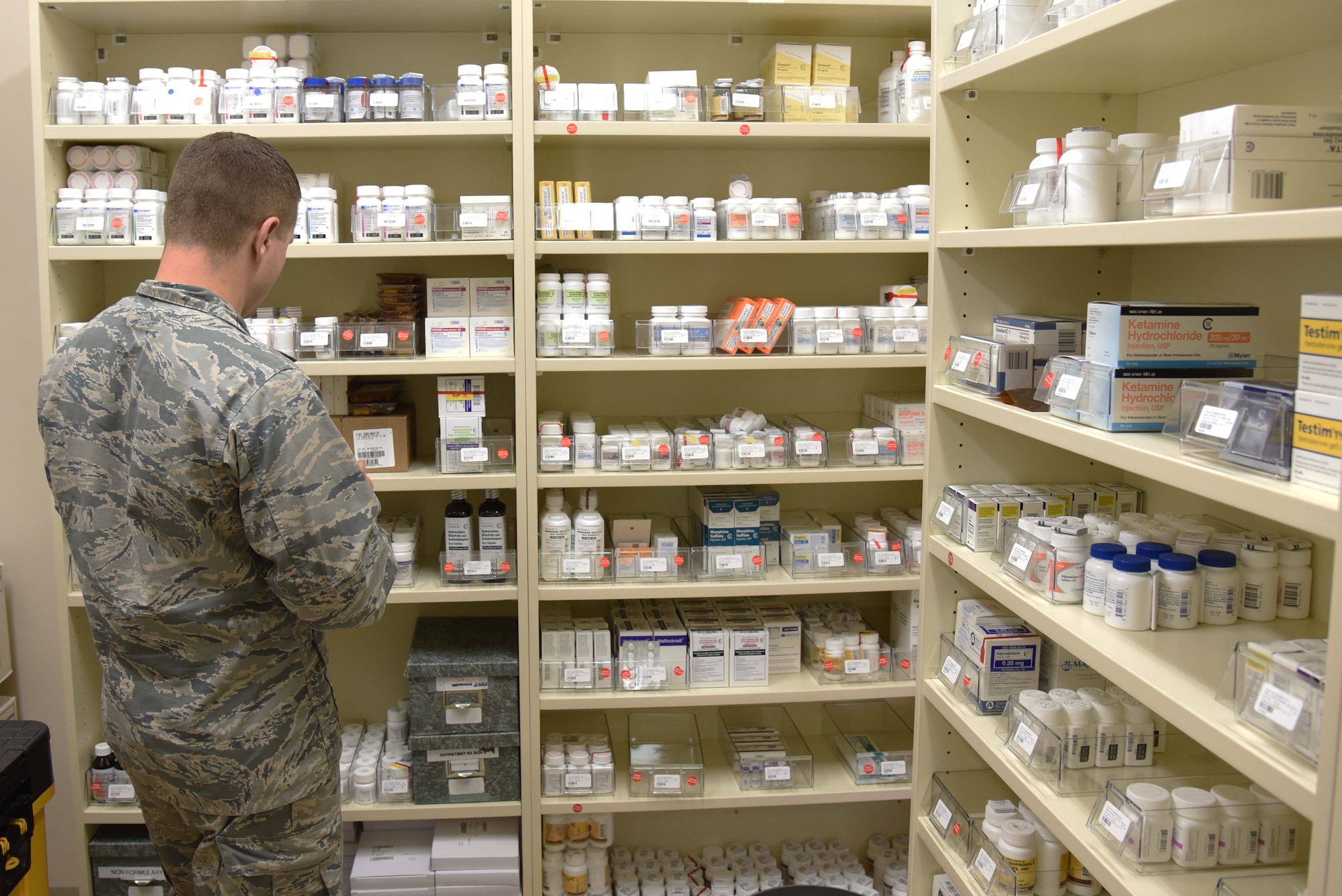 U.S. Air Force Capt. Justin Read, 35th Medical Support Squadron chief of outpatient pharmacy, searches for a patient’s prescription at Misawa Air Base, Japan, June 17, 2015. Read takes prescription information from his inventory and uses it to find a patient’s medicine located within a sealed storage vault. During operational readiness exercises, the pharmacy staff prepares various prescriptions to treat a variety of ailments. (U.S. Air Force photo by Senior Airman Patrick S. Ciccarone/Released)