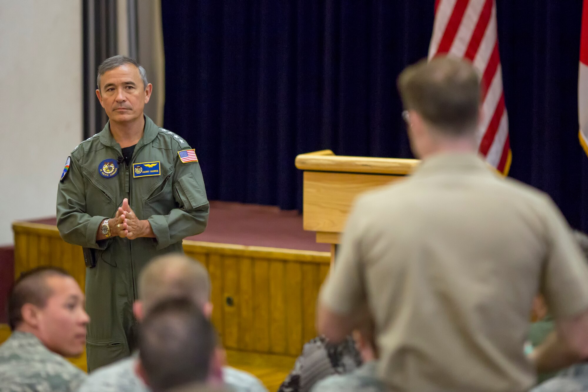 U.S. Pacific Command Commander Adm. Harry B. Harris Jr., answers a question during a town hall meeting Q-and-A session at Yokota Air Base, Japan, June 11, 2015. Harris visited Yokota during his first official visit to the Indo-Asia Pacific region, with stops in Korea and Japan. (U.S. Air Force photo by Osakabe Yasuo/Released)
