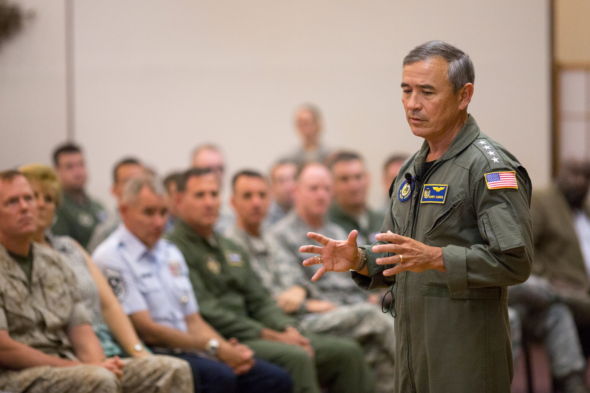 U.S. Pacific Command Commander Adm. Harry B. Harris Jr., addresses an audience of Team Yokota service members during a town hall meeting at Yokota Air Base, Japan, June 11, 2015. Harris visited Yokota during his first official visit to the Indo-Asia Pacific region, with stops in Korea and Japan. (U.S. Air Force photo by Osakabe Yasuo/Released)