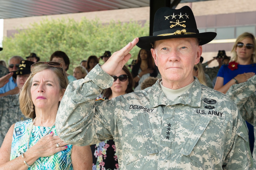Army Gen. Martin E. Dempsey, chairman of the Joint Chiefs of Staff, and his wife, Deanie , attend change-of-command ceremonies for 3rd Cavalry Regiment's Regimental Support and Tiger squadrons at Cooper Field on Fort Hood, Texas, June 19, 2015.