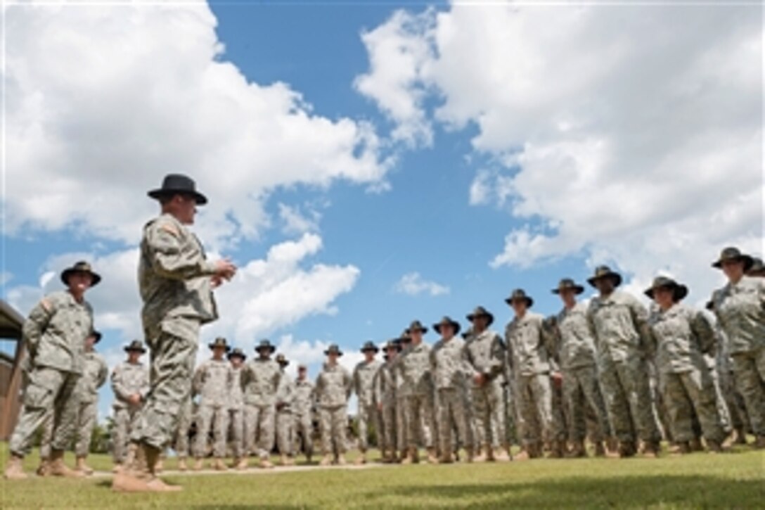 Army Gen. Martin E. Dempsey, chairman of the Joint Chiefs of Staff, talks with service members assigned to 3rd Cavalry Regiment on Fort Hood, Texas, June 18, 2015.