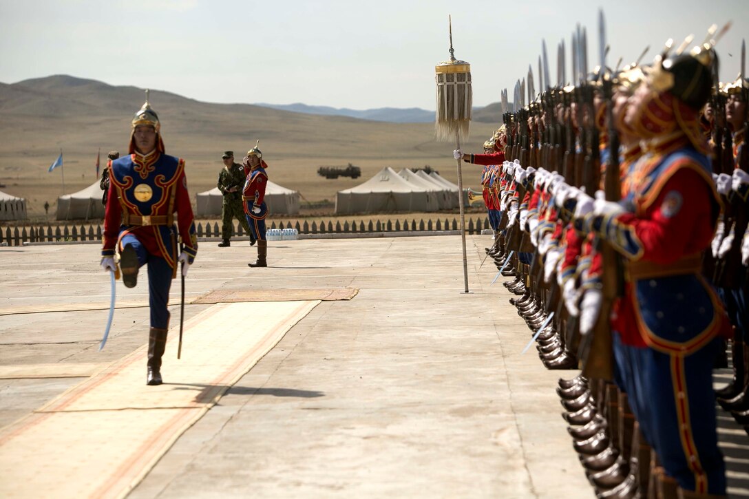 A Mongolian soldier with the Mongolian Armed Forces takes charge of a formation during the opening ceremonies of Exercise Khaan Quest 2015 at Five Hills Training Area in Tavantolgoi, Mongolia, June 15, 2015. Khaan Quest is a regularly scheduled, multinational exercise hosted annually by Mongolian Armed Forces and co-sponsored by U.S. Army, Pacific, and U.S. Marine Corps Forces, Pacific. KQ15 is the latest in a continuing series of exercises designed to promote regional peace and security. This year marks the 13th iteration of this training event.