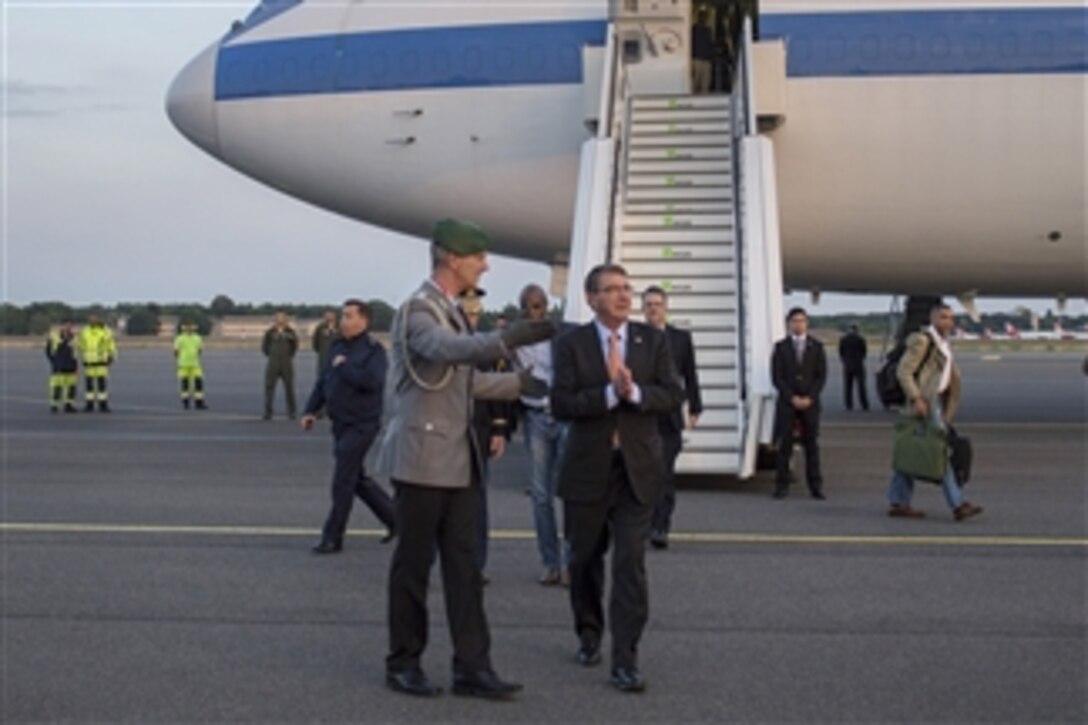 U.S. Defense Secretary Ash Carter talks with German Army Lt. Col. Frank Gaebel,a representative from the German Ministry of Defense, upon his arrival in Berlin, June 21, 2015. 