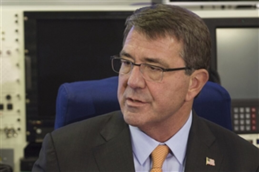 U.S. Defense Secretary Ash Carter talks with news reporters aboard an aircraft en route to Berlin, June 21, 2015. Carter plans to meet with European defense ministers and participate in his first NATO ministerial as defense secretary during the trip to Germany, Estonia and Belgium. 