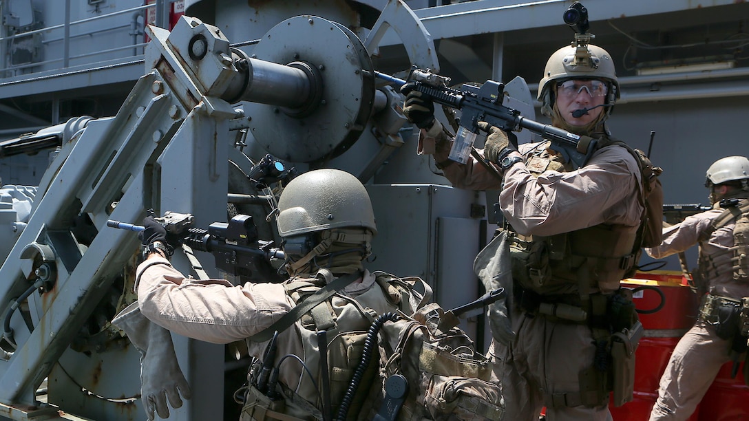 U.S. Marines with Force Reconnaissance Platoon, Maritime Raid Force, 26th Marine Expeditionary Unit (MEU), provide security while conducting visit, board, search and seizure training during an Amphibious Ready Group/Marine Expeditionary Unit Exercise (ARG/MEU-Ex) aboard the USNS Robert E. Peary June 19, 2015. Marines and sailors with the 26th MEU and Amphibious Squadron 4 are conducting an ARG/MEU-Ex in preparation for their deployment to the 5th and 6th Fleet areas of responsibility later this year. 