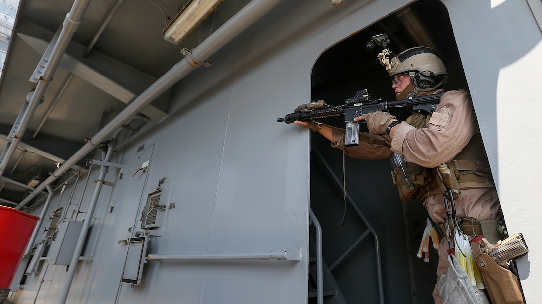 A U.S. Marine with Force Reconnaissance Platoon, Maritime Raid Force, 26th Marine Expeditionary Unit (MEU), provides security while conducting visit, board, search and seizure training during an Amphibious Ready Group/Marine Expeditionary Unit Exercise (ARG/MEU-Ex) aboard the USNS Robert E. Peary June 19, 2015. Marines and sailors with the 26th MEU and Amphibious Squadron 4 are conducting an ARG/MEU-Ex in preparation for their deployment to the 5th and 6th Fleet areas of responsibility later this year. 