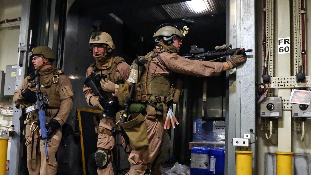 U.S. Marine with Force Reconnaissance Platoon, Maritime Raid Force, 26th Marine Expeditionary Unit (MEU) clear a passageway while conducting visit, board, search and seizure training during an Amphibious Ready Group/Marine Expeditionary Unit Exercise (ARG/MEU-Ex) aboard the USNS Robert E. Peary June 19, 2015. Marines and sailors with the 26th MEU and Amphibious Squadron 4 are conducting an ARG/MEU-Ex in preparation for their deployment to the 5th and 6th Fleet areas of responsibility later this year. 