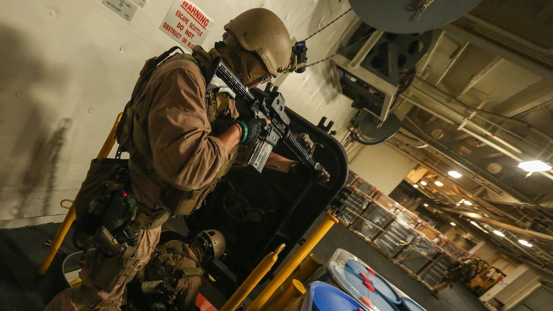 U.S. Marines with Force Reconnaissance Platoon, Maritime Raid Force, 26th Marine Expeditionary Unit (MEU), clear a stairwell while conducting visit, board, search and seizure training during an Amphibious Ready Group/Marine Expeditionary Unit Exercise (ARG/MEU-Ex) aboard the USNS Robert E. Peary June 19, 2016. Marines and sailors with the 26th MEU and Amphibious Squadron 4 are conducting an ARG/MEU-Ex in preparation for their deployment to the 5th and 6th Fleet areas of responsibility later this year.