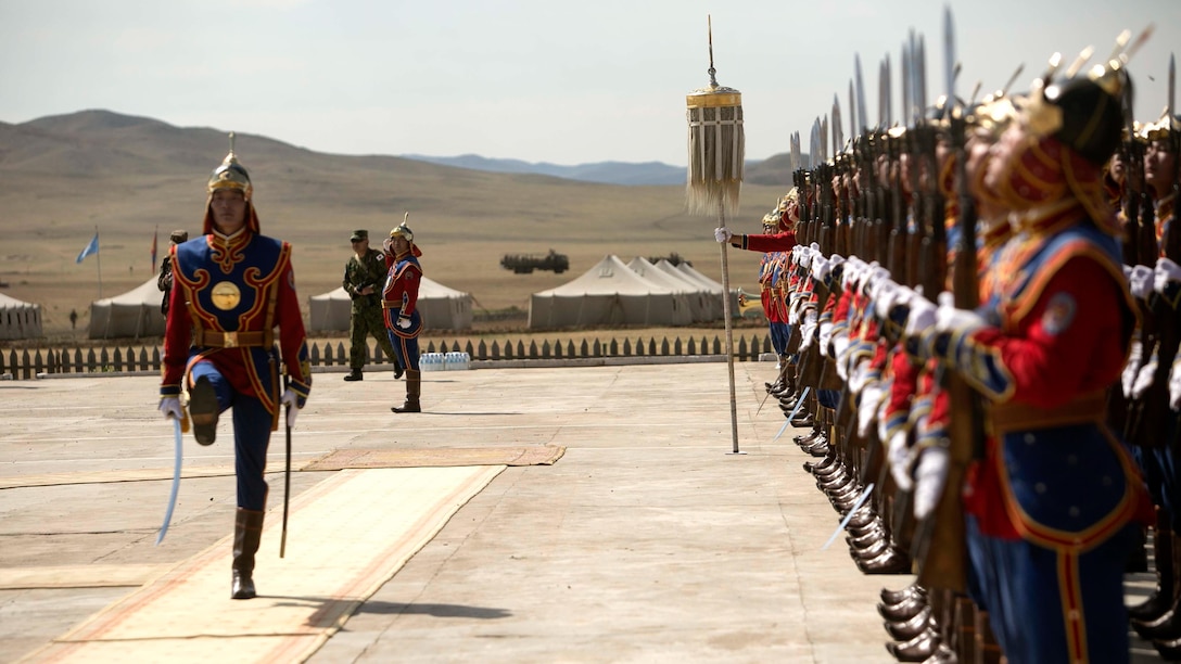 A Mongolian soldier with the Mongolian Armed Forces takes charge of a formation during the opening ceremonies of Exercise Khaan Quest 2015 at Five Hills Training Area in Ulaanbaatar, Mongolia, June 15, 2015. Khaan Quest is a regularly scheduled, multinational exercise hosted annually by Mongolian Armed Forces and co-sponsored by U.S. Army, Pacific, and U.S. Marine Corps Forces, Pacific. KQ15 is the latest in a continuing series of exercises designed to promote regional peace and security. This year marks the 13th iteration of this training event. 