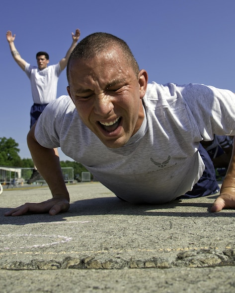 U.S. Air Force Master Sgt. Landon Bonds, 73rd Aerial Port Squadron Port Dawg Challenge participant, performs a burpee while competing in the fit to fight section of the Port Dawg Challenge at Dobbins Air Reserve Base, Ga., June 18, 2015. The Port Dawg Challenge was created to enhance and maintain the camaraderie, esprit de corps and prestige of Aerial Port Airmen while promoting professionalism, leadership, training and communication between "Port Dawgs." (U.S. Air Force photo by Senior Airman Josh Slavin/Released)