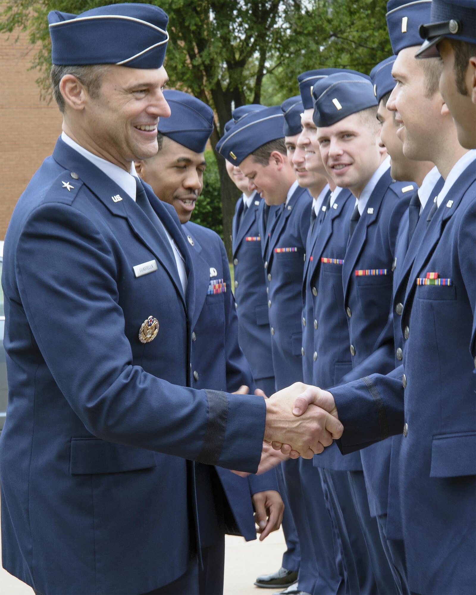 Brig. Gen. Joseph Guastella, the deputy director for requirements (J8), Joint Staff, the Pentagon, greets Joint Specialized Undergraduate Pilot Training Class 15-10 graduates at Vance Air Force Base, Oklahoma, June 12. (U.S. Air Force photo by David Poe)
