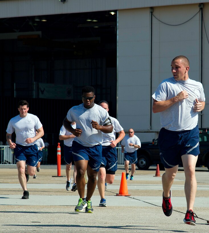 U.S. Air Force Airmen from the 27th and 73rd Aerial Port Squadrons complete one of five laps while competing in the fit-to-fight section of the Port Dawg Challenge at Dobbins Air Reserve Base, Ga., June 18, 2015. The Port Dawg Challenge was created to enhance and maintain the camaraderie, esprit de corps and prestige of Aerial Port Airmen while promoting professionalism, leadership, training and communication between "Port Dawgs." (U.S. Air Force photo by Senior Airman Josh Slavin/Released)