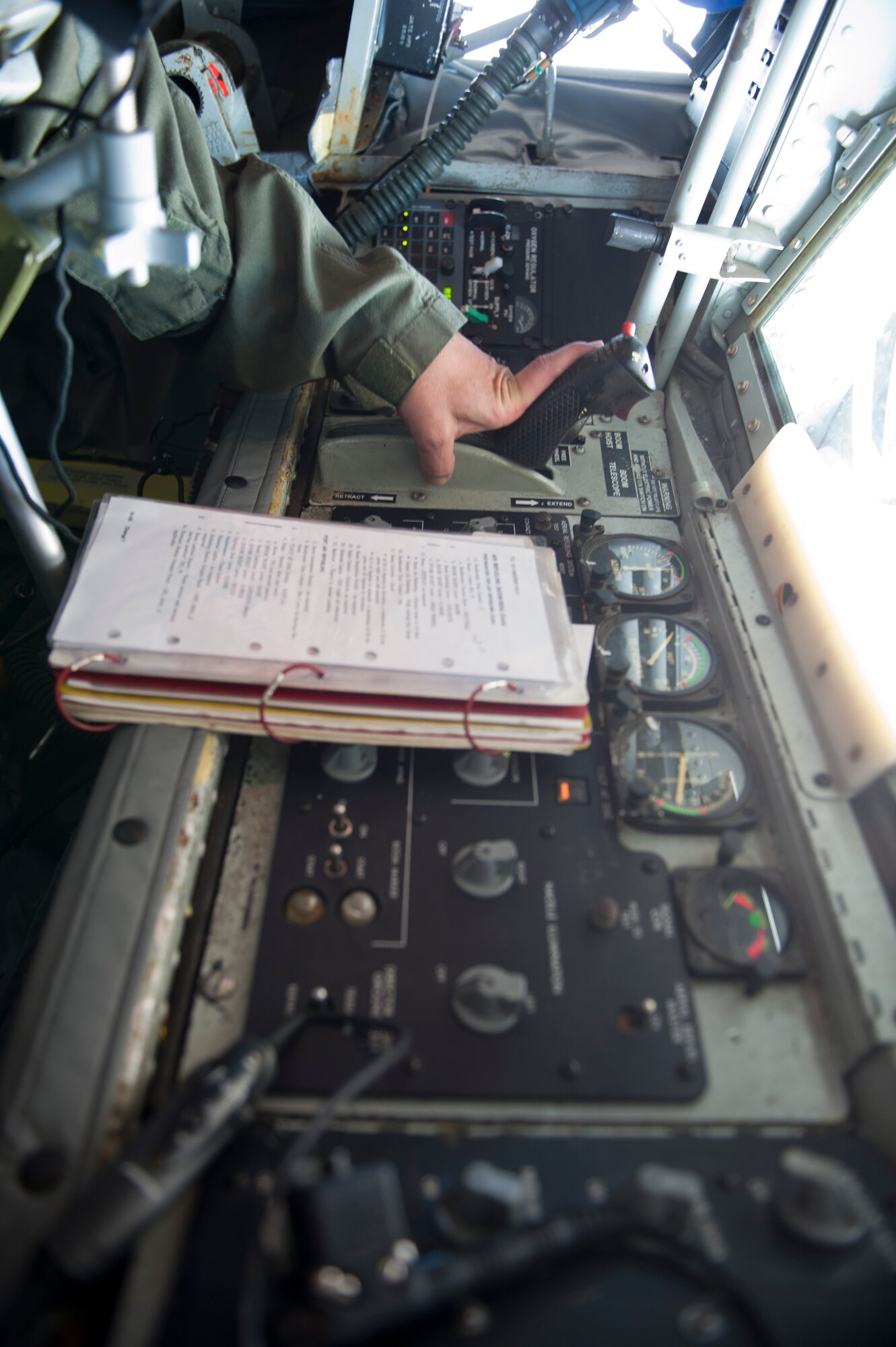 Chief Master Sgt. Carlos Trujillo, 161st Air Refueling Wing boom operator, Arizona Air National Guard, prepares to refuel 61st Fighter Squadron F-35 Lightning IIs, June 5, 2015. Air-to-air refueling allows pilots to extend the combat radius of their aircraft. (U.S. Air Force photo by Staff Sgt. Staci Miller)