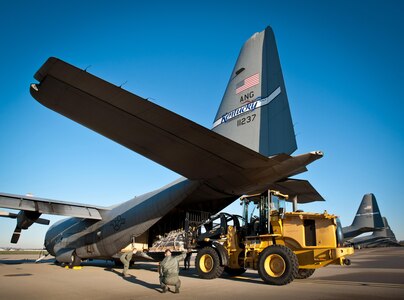 Loadmasters from the 123rd Airlift Wing direct a pallet of cargo onto a C-130 aircraft on the flight line of the Kentucky Air National Guard Base in Louisville, Ky., April 2, 2011, as nearly 50 Kentucky Air Guard aircrew members, maintenance personnel and support troops prepared to deploy to San Juan, Puerto Rico, in support of Operation Coronet Oak. The mission provides vital airlift capabilities throughout the U.S. Southern Command Area of Responsibility. (U.S. Air Force photo by Maj. Dale Greer)