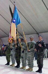 U.S. Army Soldiers from the 111th Maneuver Enhancement Brigade of the New
Mexico National Guard, aided by troops from Ukraine, France and Greece,
present the national and brigade colors during the transition of authority
ceremony between KFOR-13 and KFOR-14 at Camp Bondsteel, Kosovo, April 2,
2011. The 92nd MEB had been providing safey and security in Kosovo since
they took over the mission in July. 