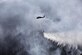 An Alaska Army National Guard UH-60 Black Hawk from 1st Battalion, 207th Aviation Regiment, drops approximately 700 gallons of water from a “Bambi Bucket” on to the Stetson Creek Fire near Cooper Landing, Alaska, June 17, 2015. Two Black Hawks flew a total of 200 bucket missions, dumping more than 144,000 gallons of water on the 300-acre Stetson Creek Fire on the Kenai Peninsula. (U.S. Army National Guard photo/Sgt. Balinda O’Neal)