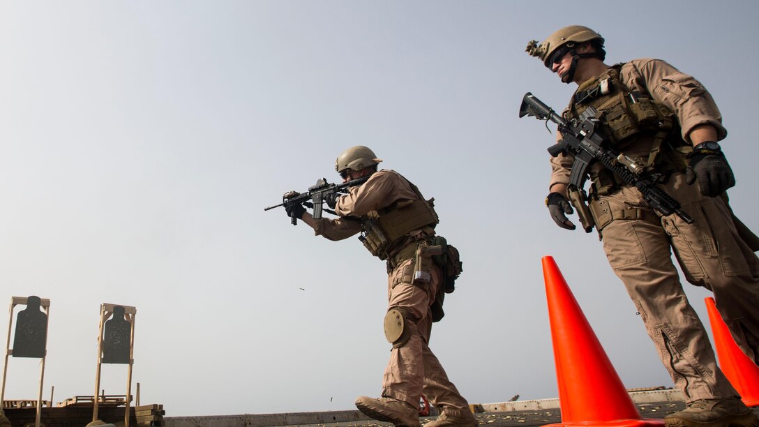 A Marine with the Maritime Raid Force, 24th Marine Expeditionary Unit, participates in a live-fire training exercise on the flight deck of the amphibious transport dock ship USS New York (LPD 21) in the Gulf of Aden, June 14, 2015. The 24th MEU is embarked on the ships of the Iwo Jima Amphibious Ready Group and is deployed to maintain regional security in the U.S. 5th Fleet Area of operations. 