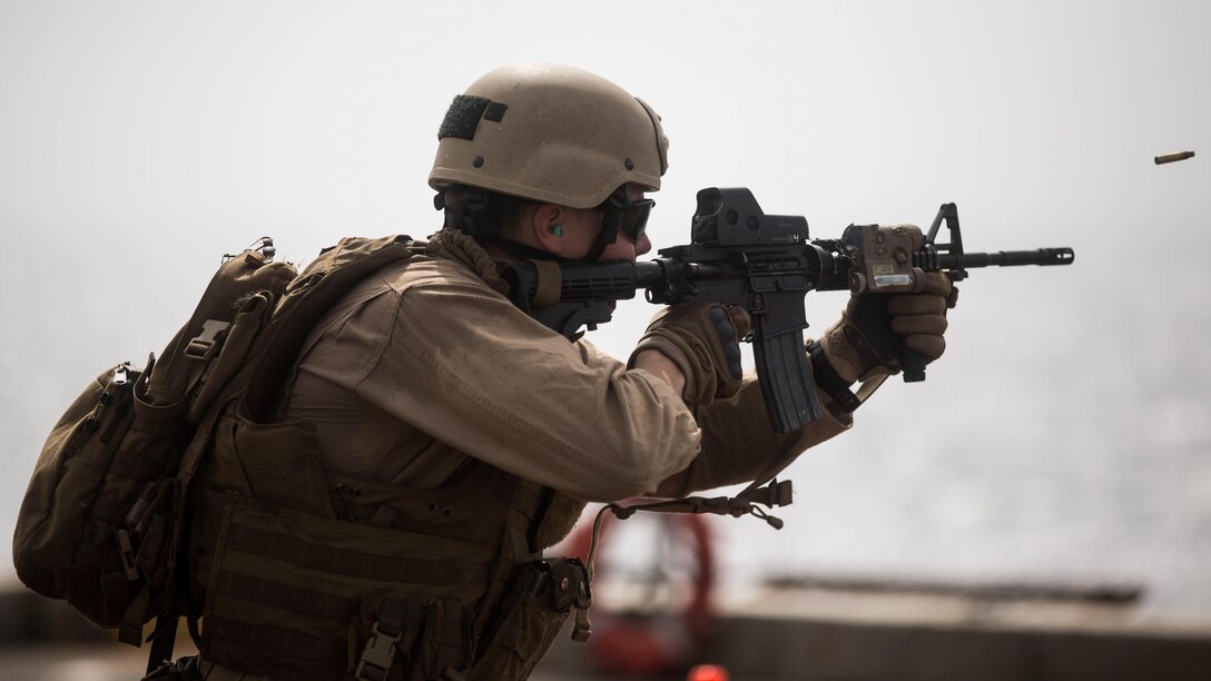 A Marine with the Maritime Raid Force, 24th Marine Expeditionary Unit, participates in a live-fire training exercise on the flight deck of the amphibious transport dock ship USS New York (LPD 21) in the Gulf of Aden, June 14, 2015. The 24th MEU is embarked on the ships of the Iwo Jima Amphibious Ready Group and is deployed to maintain regional security in the U.S. 5th Fleet Area of operations.