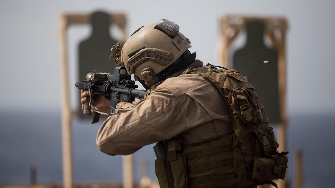 A Marine with the Maritime Raid Force, 24th Marine Expeditionary Unit, participates in a live-fire training exercise on the flight deck of the amphibious transport dock ship USS New York (LPD 21) in the Gulf of Aden, June 14, 2015. The 24th MEU is embarked on the ships of the Iwo Jima Amphibious Ready Group and is deployed to maintain regional security in the U.S. 5th Fleet Area of operations. 