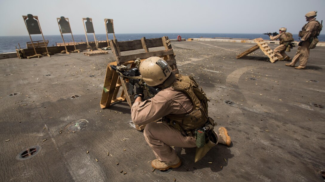 Marines with the Maritime Raid Force, 24th Marine Expeditionary Unit, participate in a live-fire training exercise on the flight deck of the amphibious transport dock ship USS New York (LPD 21) in the Gulf of Aden, June 14, 2015. The 24th MEU is embarked on the ships of the Iwo Jima Amphibious Ready Group and is deployed to maintain regional security in the U.S. 5th Fleet Area of operations. 