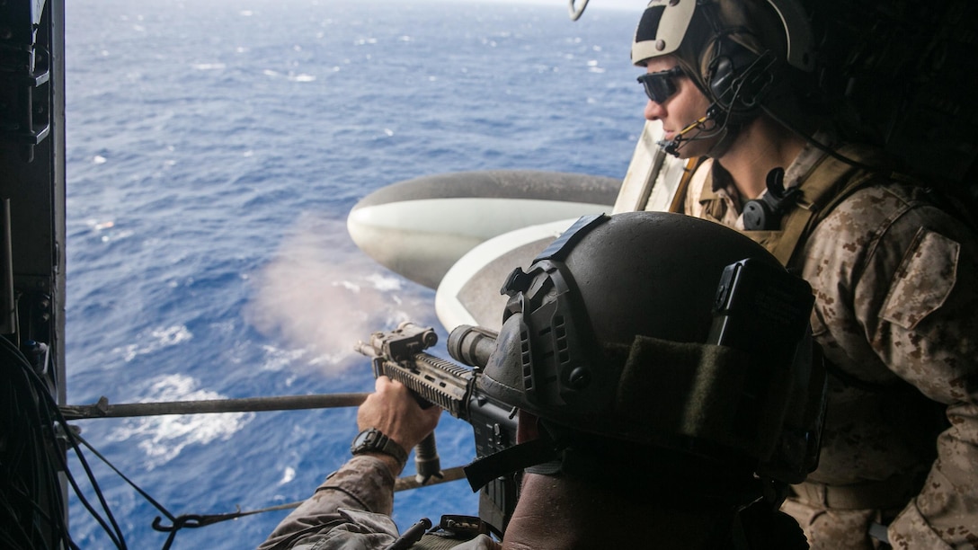 U.S. Marine Sgt. Jesse Kimble shoots at a floating target from a CH-53E Super stallion. Kimble is a member of the 15th Marine Expeditionary Unit’s Maritime Raid Force. The Marines practiced aerial sniper techniques to become more comfortable and proficient shooting from an aircraft. The 15th MEU is embarked on the Essex Amphibious Ready Group and deployed to maintain regional security in the U.S. 5th Fleet area of operations.