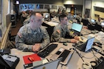 Staff Sgt. Nick Suko, left and Sgt. Justin Valenti are members of the North
Dakota National Guard Joint Task Force East participating in flood-fighting
operations April 6, 2011, at the North Dakota Air National Guard, Fargo,
N.D. The high-tech flood-fighting operations center is being manned 24-hours
per day until it is no longer necessary.